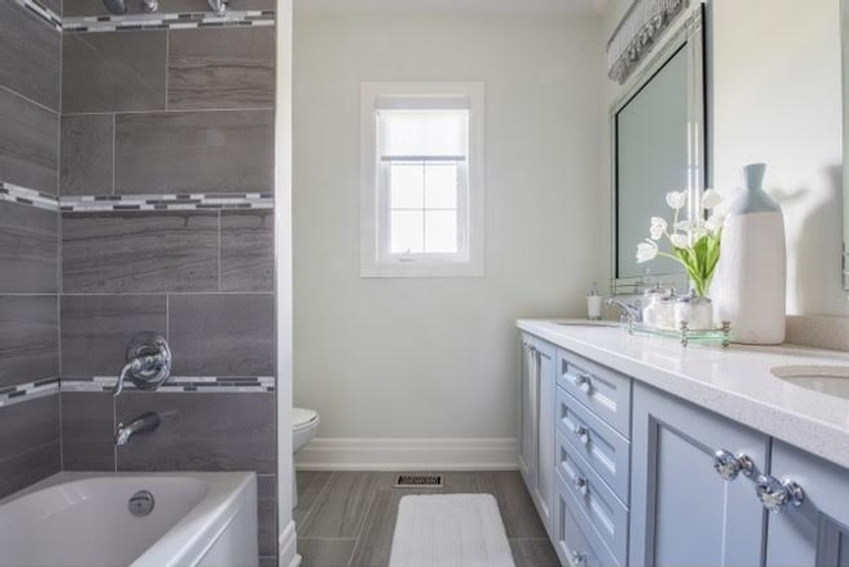 Elegant White and Blue Bathroom Renovations Aurora by Royal Interior Design Ltd